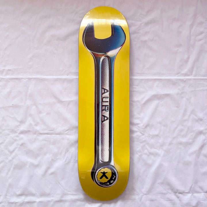 Aura “Yellow Wrench” 8.25” x 32” Skateboard Deck — underside graphic view
