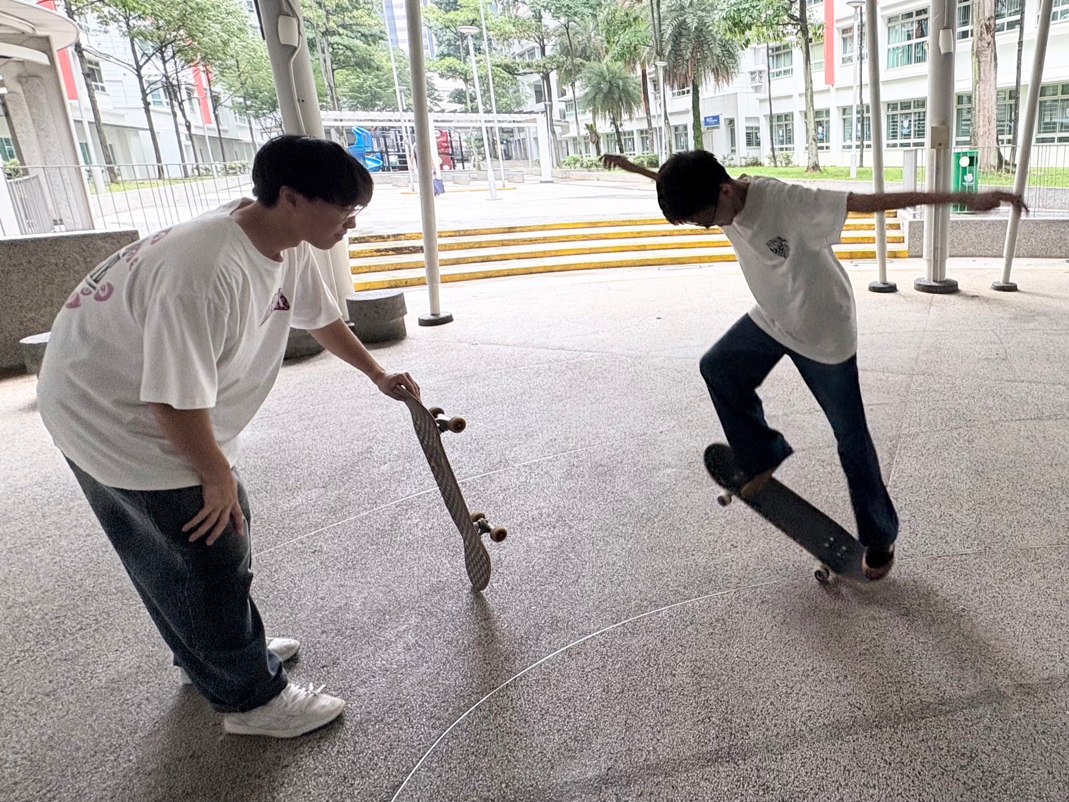 A coach helping a rider develop a new board skill